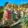 Medieval buildings terraced into a bluff of Cinque Terre.